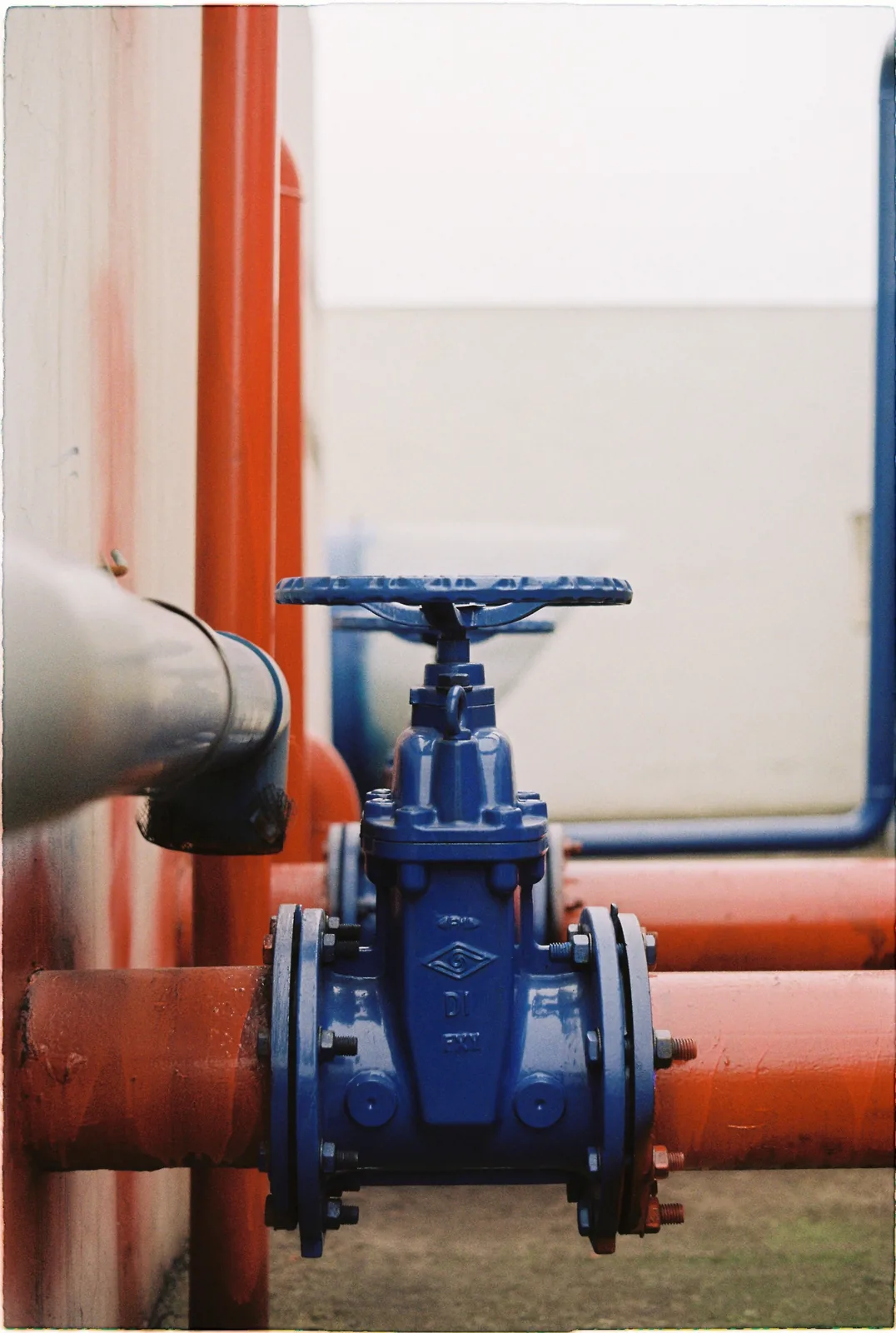 A pressure gauge and valve on treatment unit pipework